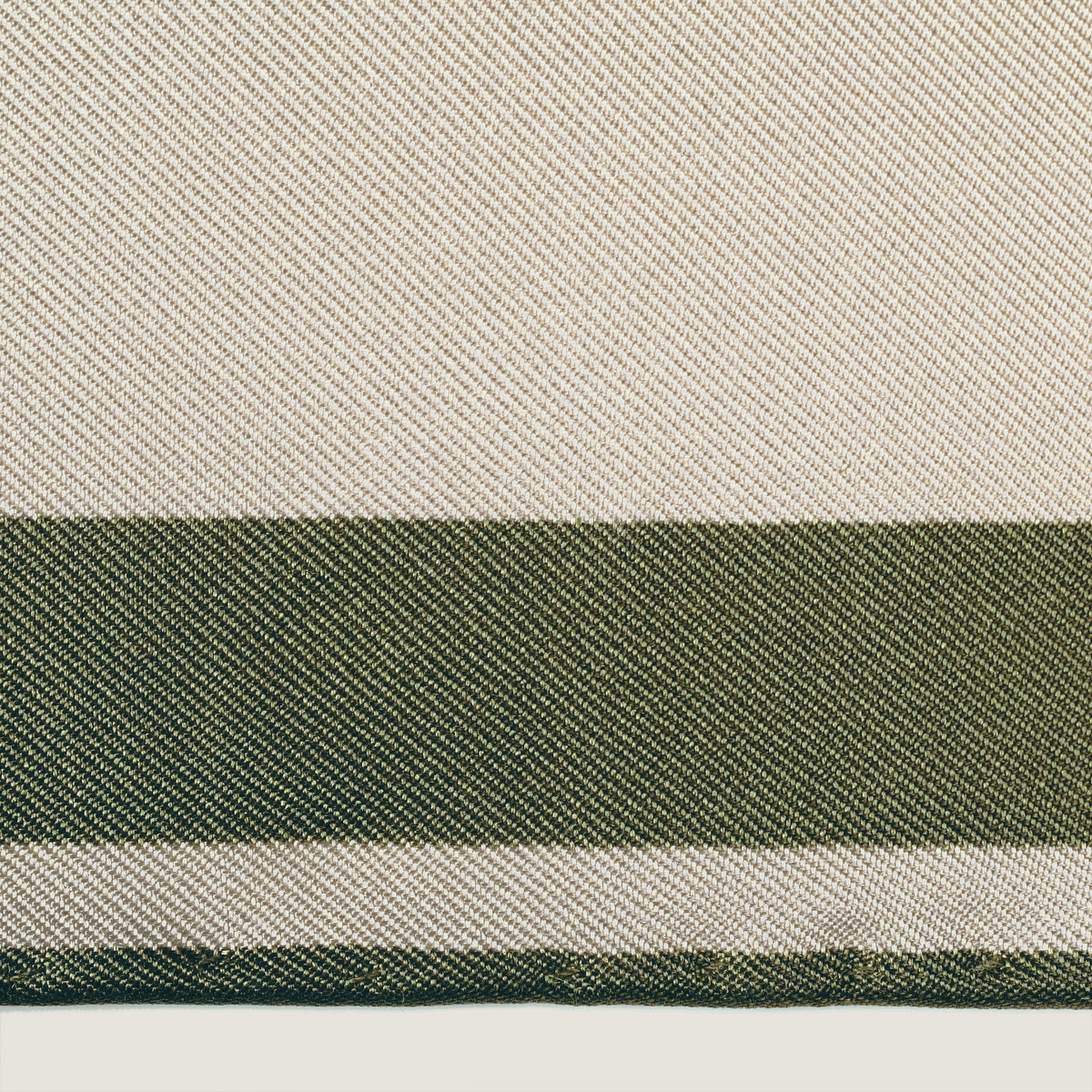 The Crossing silk carré — silk twill and hand-rolled edge, close up