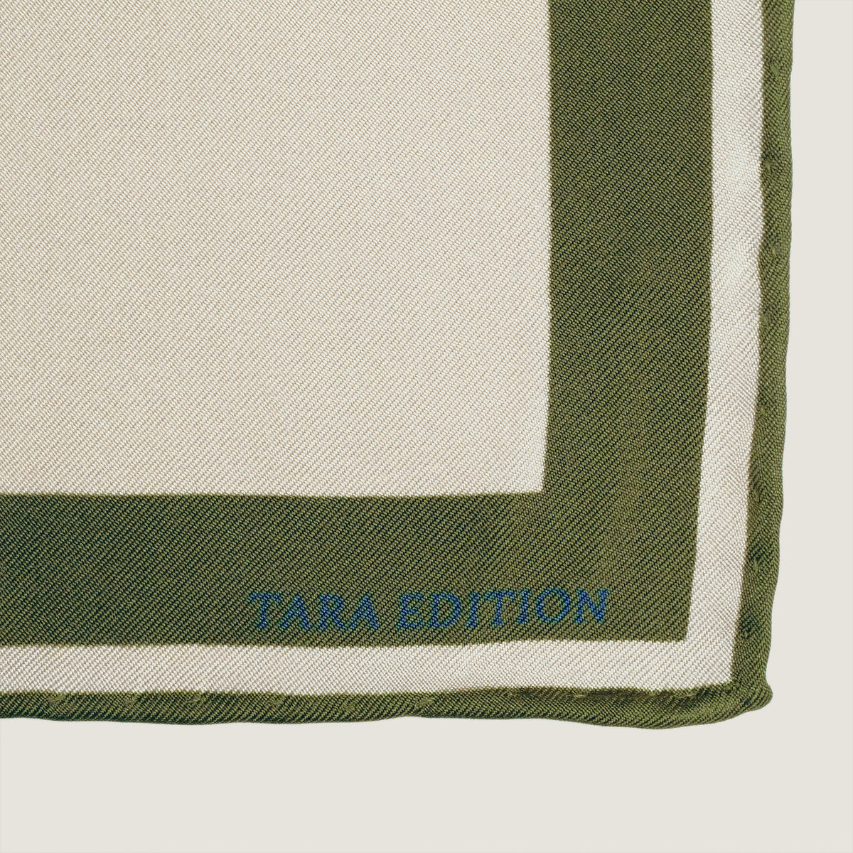 The Crossing silk carré — the TARA EDITION signature in the border