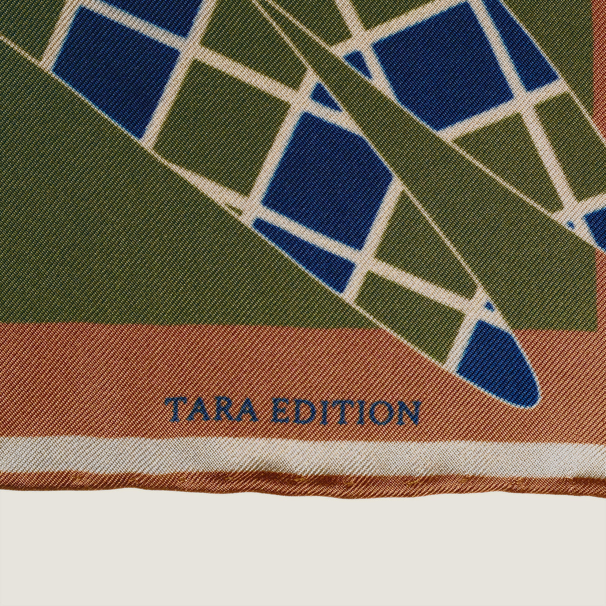 The Graft silk carré — the TARA EDITION signature in the border