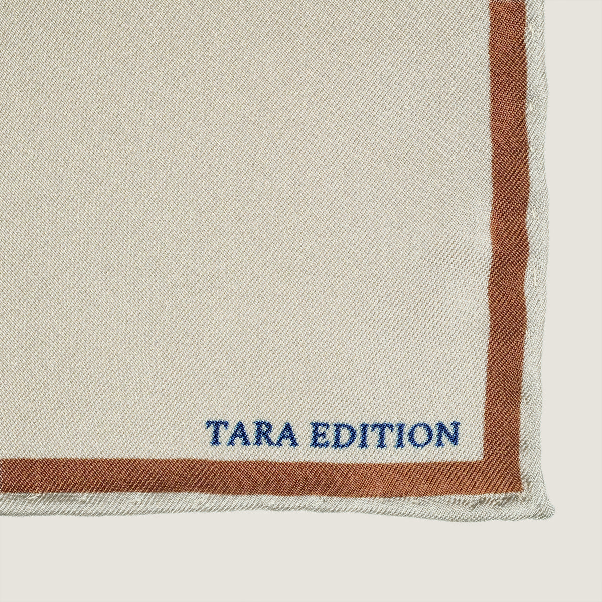 The Quatrefoil silk carré — the TARA EDITION signature in the border